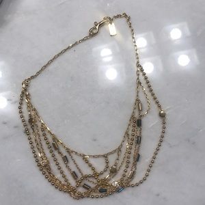 Gold coach necklace